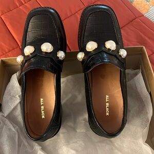 Black high lug sole loafers by All Black